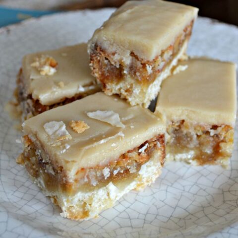 Coffee Frosted Squares stacked on a plate.