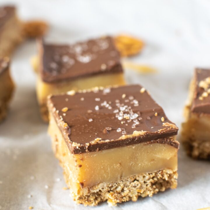 Chocolate caramel bars with a salted pretzel crust and a sprinkle of sea salt on top.