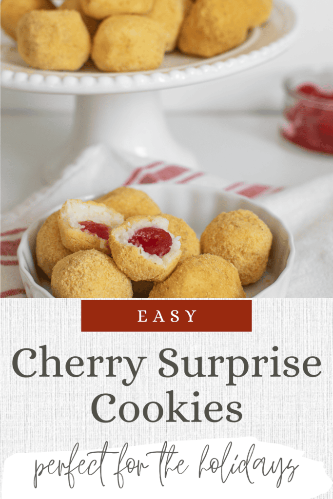 A cake plate with cherry surprise cookies in the background, with more in a bowl that are cut in half to show the maraschino cherry.