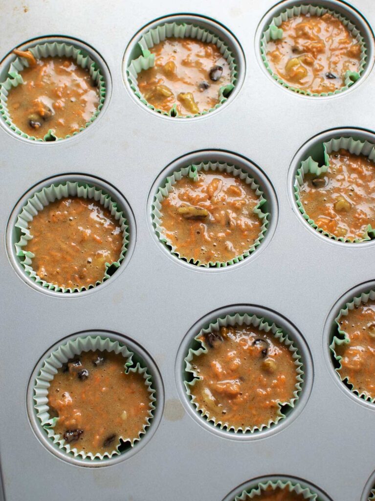 Cupcake batter in muffin tins before baking.