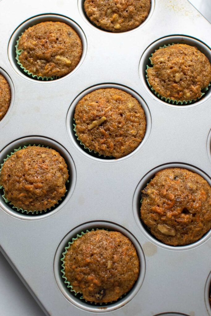 Carrot cupcakes right out of the oven and still in muffin pan.