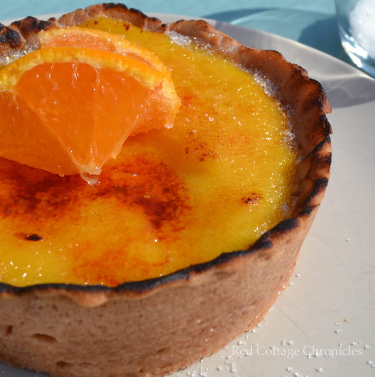 A tangerine creme brulee in a chocolate crust.