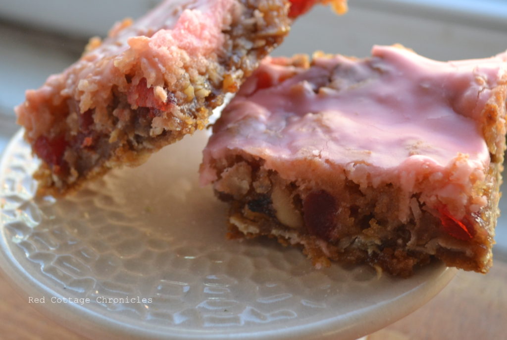 Cherry chew squares on a little cupcake stand.