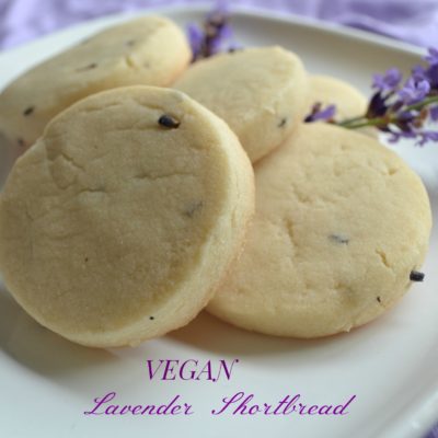 Vegan lavender shortboard cookies on a white plate.