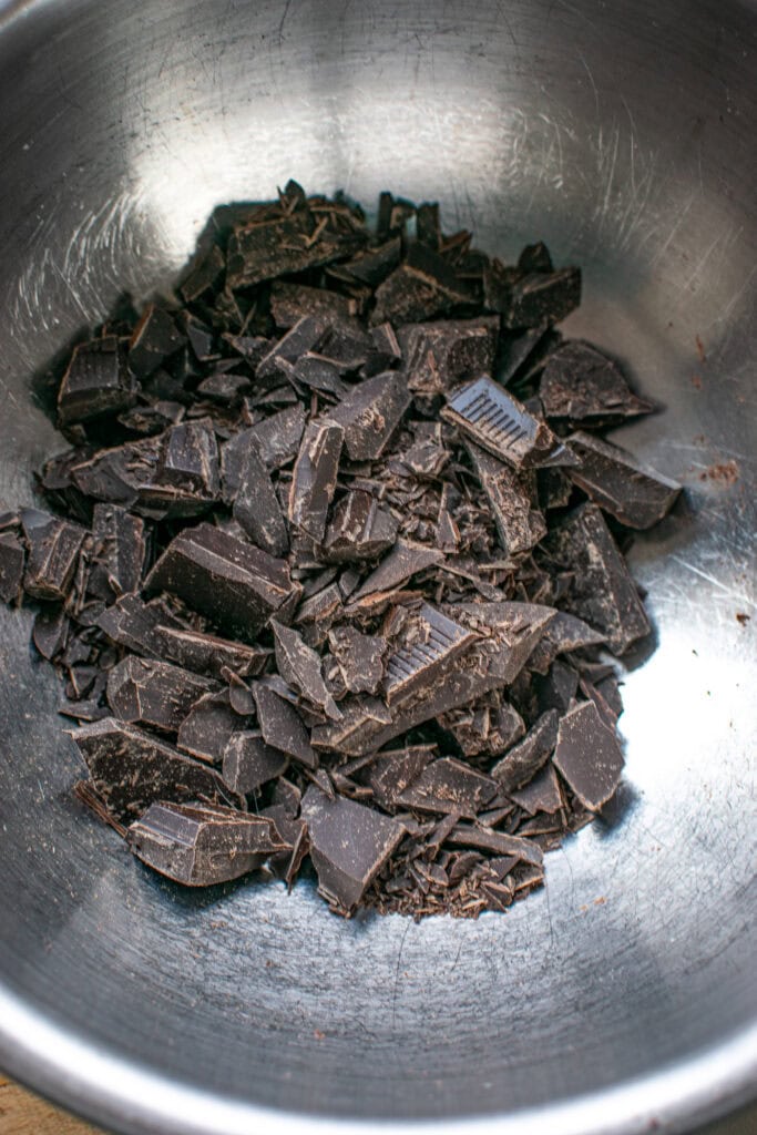 Chopped dark chocolate in a double boiler to be melted.