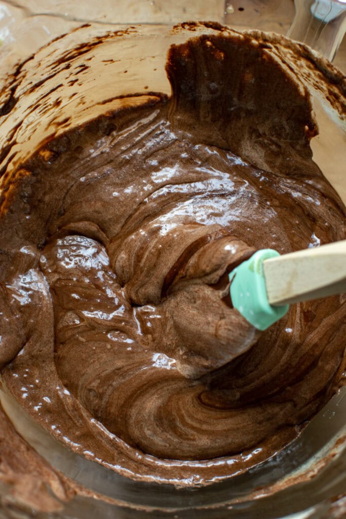 Melted dark chocolate fully combined with whipped egg/sugar mixture.