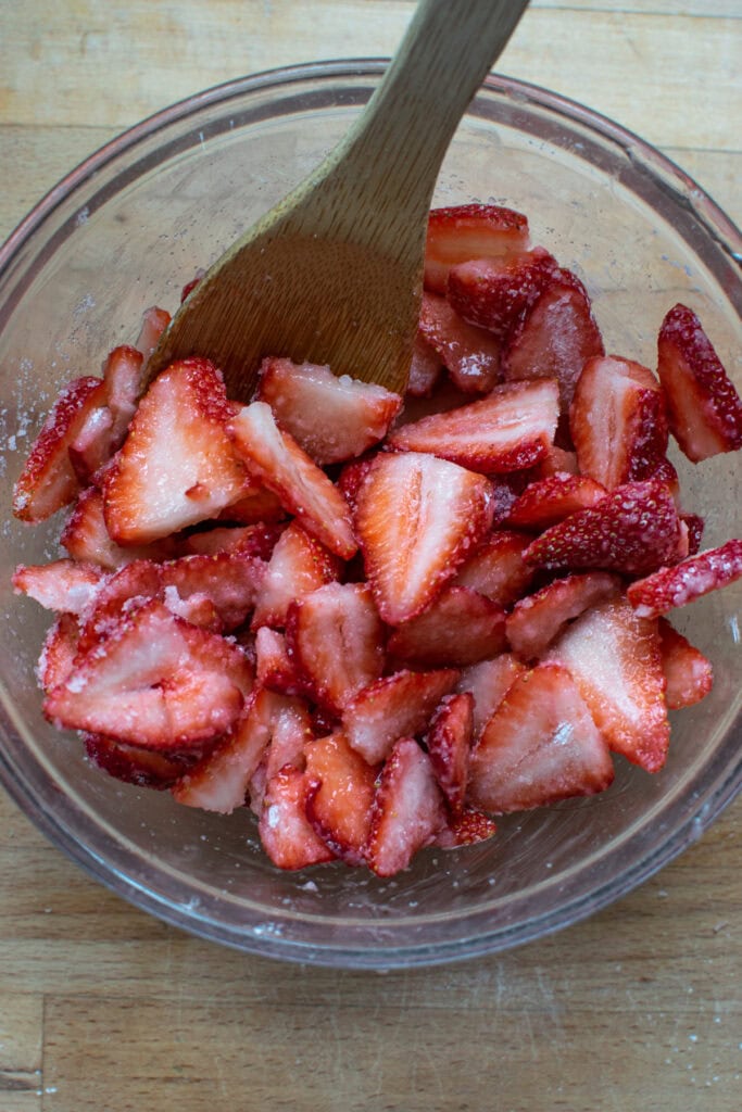 Fresh sliced strawberries that have been mixed with cornstarch and sugar.