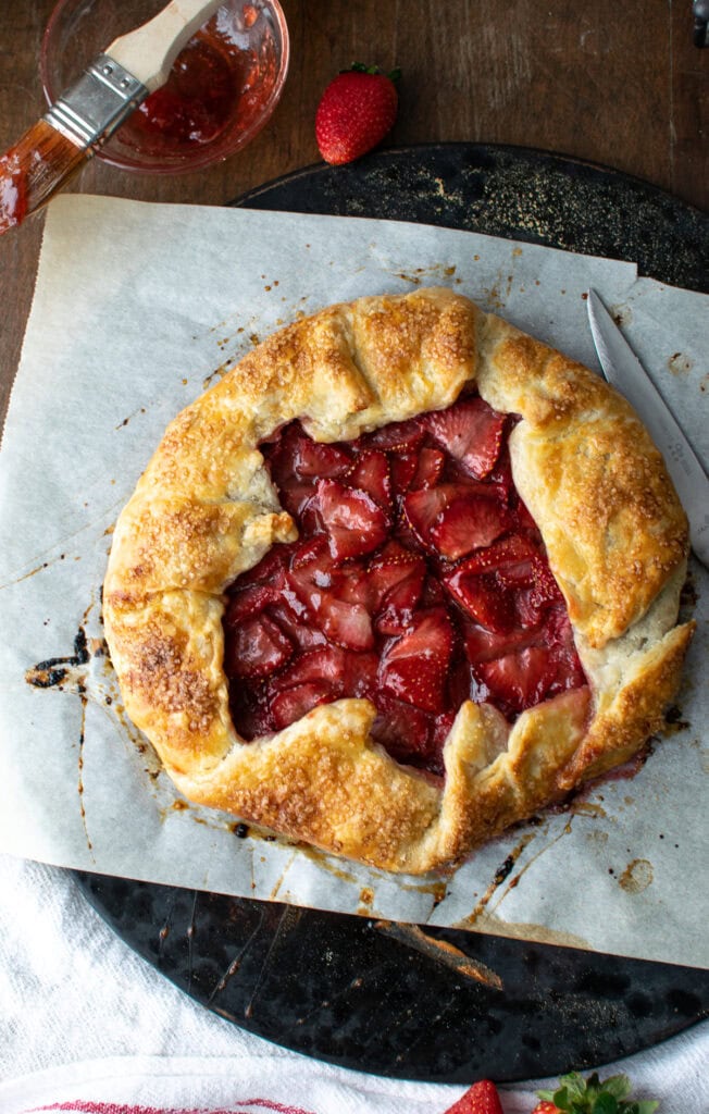 A rustic strawberry tart glazed with strawberry jam.