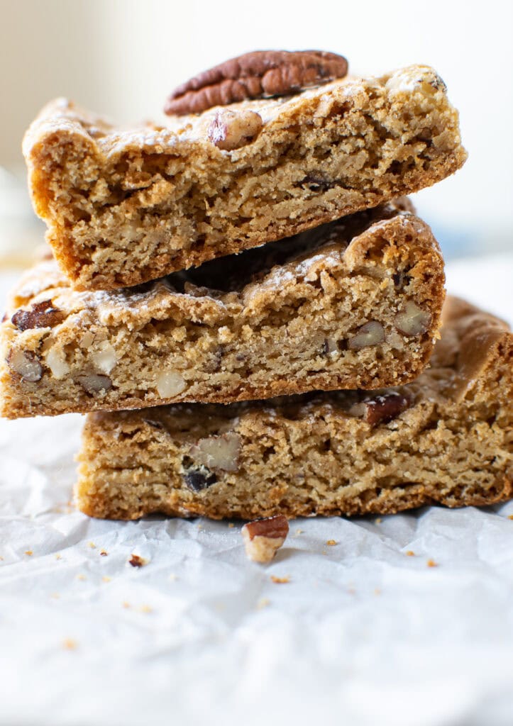 3 butter pecan blondies stacked on top of each other.