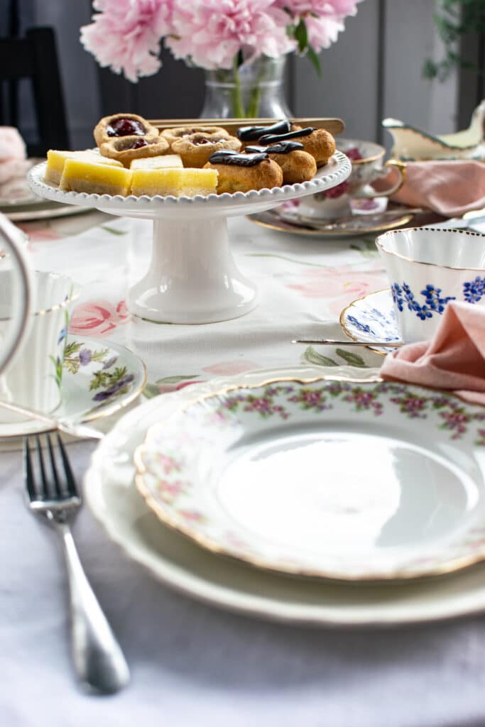 A cake stand with mini pastries for an afternoon tea party
