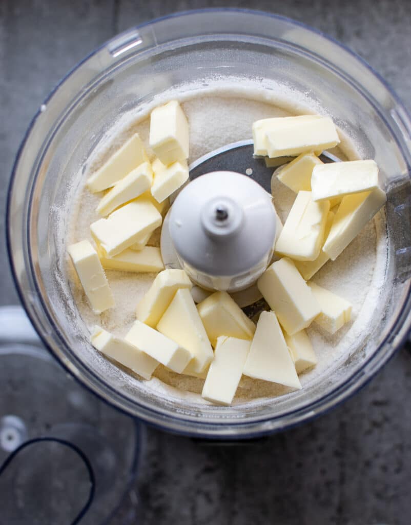 Butter added to a flour/sugar in a food processor before mixing.