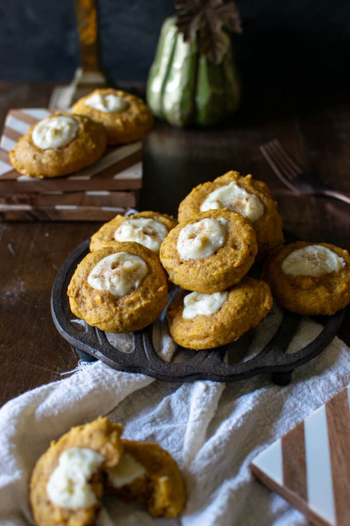 A plate of pumpkin spice cream cheese cookies on a trivet.