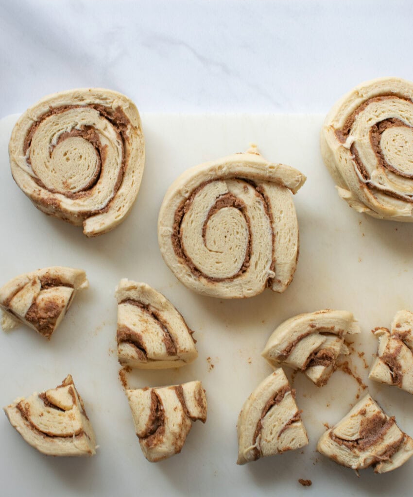 Photographs of the first three steps to make apple cinnamon cake, including chopping apples, layering in pie plate and cutting up cinnamon rolls.