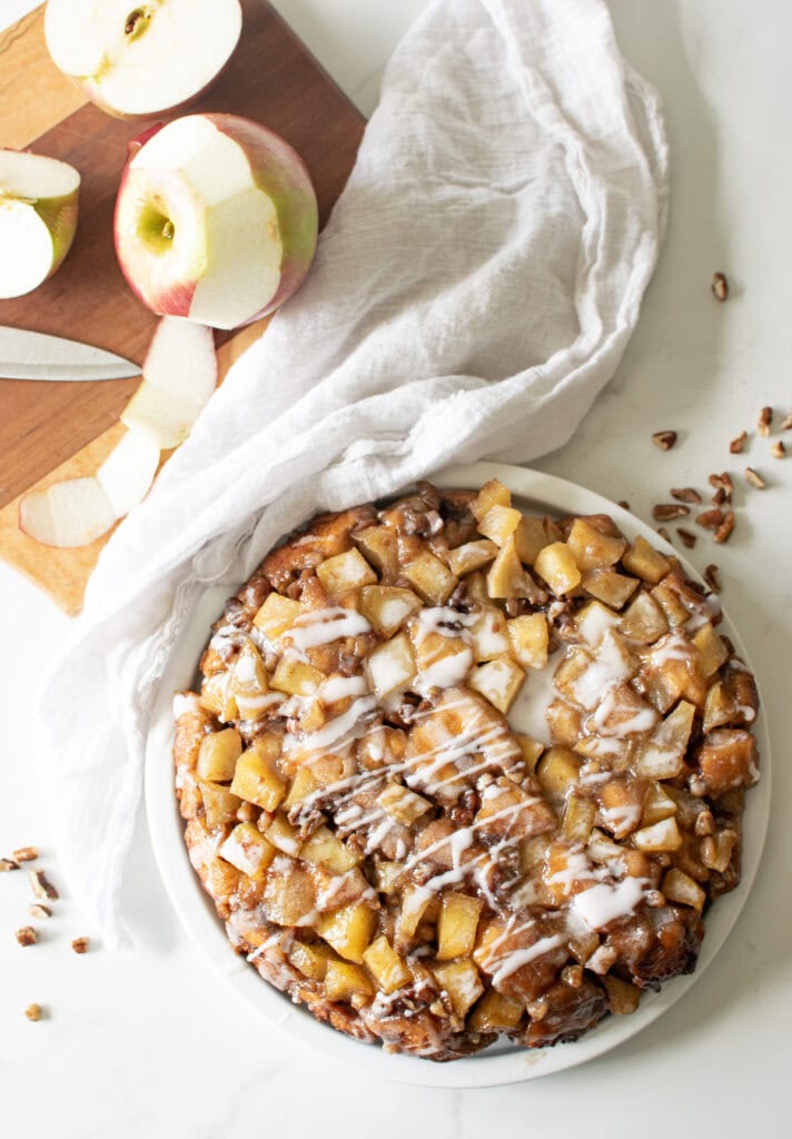 Overhead view of Cinnamon Roll Cake drizzled with frosting.