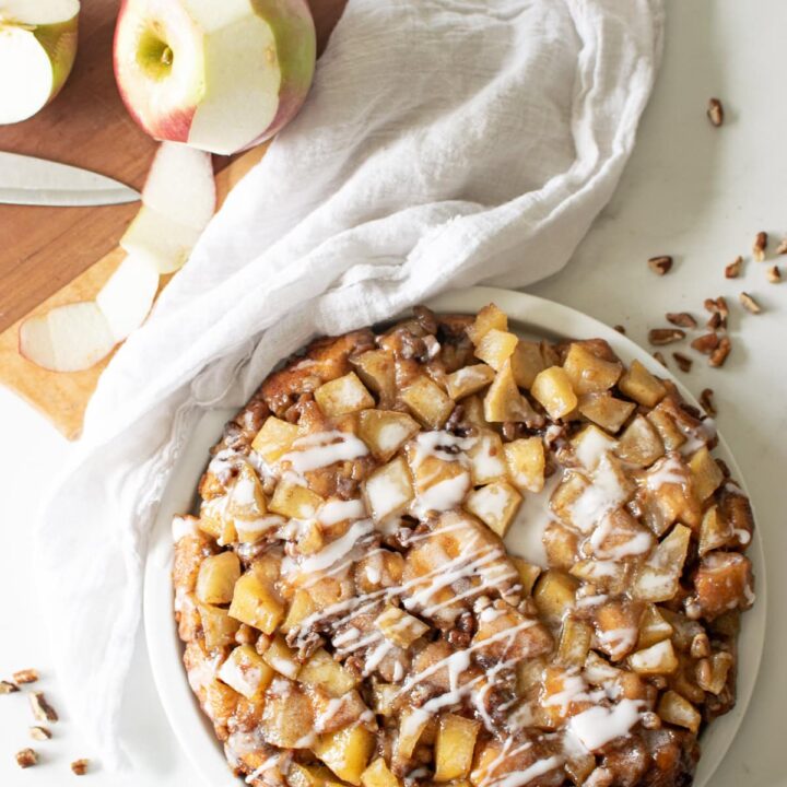 Overhead view of Cinnamon Roll Cake drizzled with frosting.