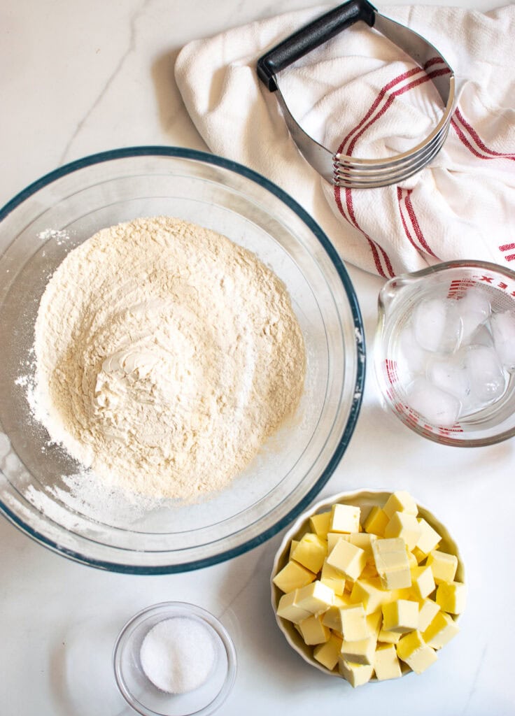 An overhead view of the ingredients to make pie pastry.