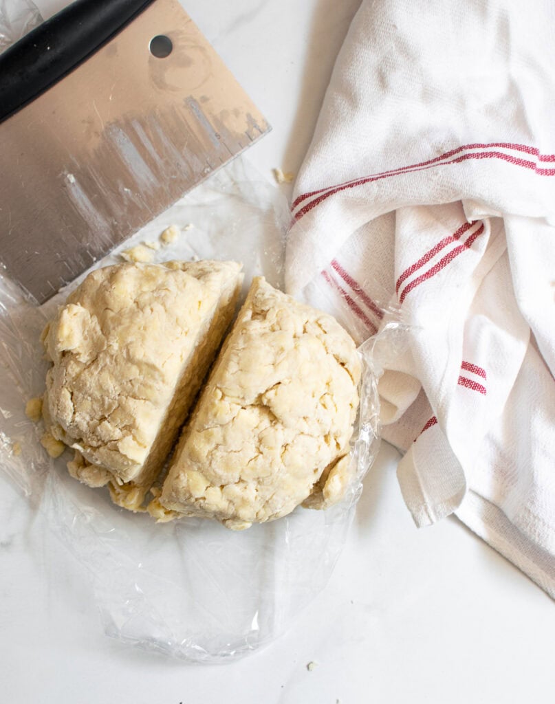 Ice water added to flour and butter mixture to make pie pastry.