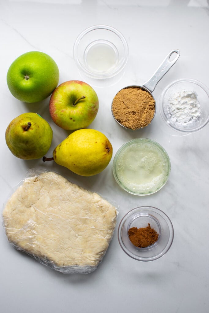 Overhead view of ingredients for making apple pear galette.