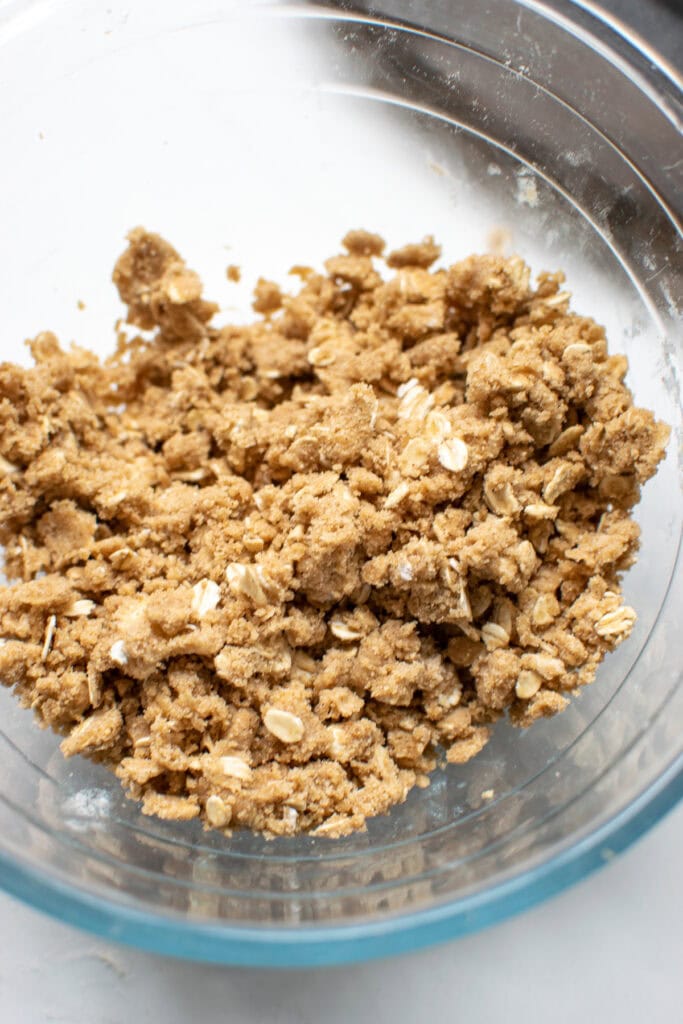 A bowl of oat crumble topping for a galette.