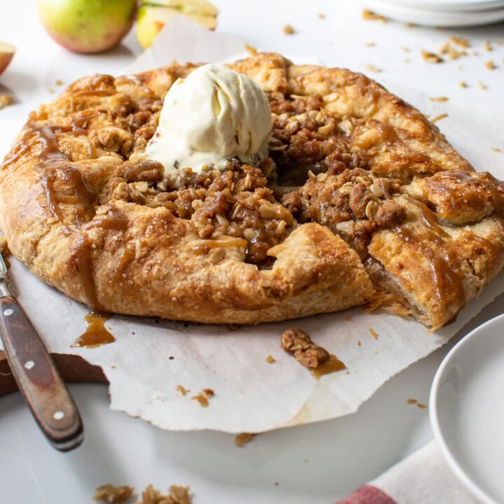 A pear and apple galette with a scoop of ice cream on top.