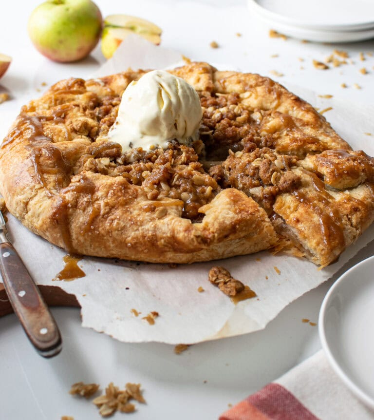 A pear and apple galette with a scoop of ice cream on top.