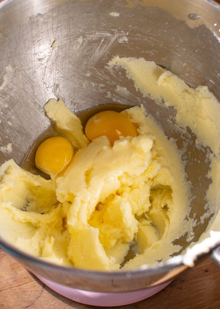 2 eggs added to mixing bowl with creamed butter and sugar.