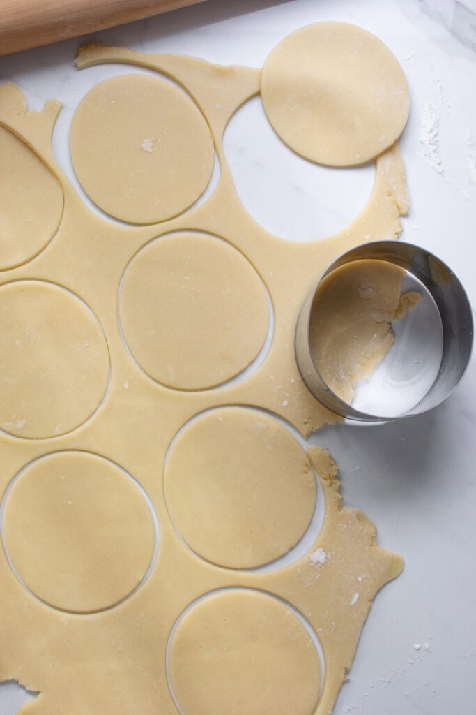 Pastry dough cut out into large round circles.