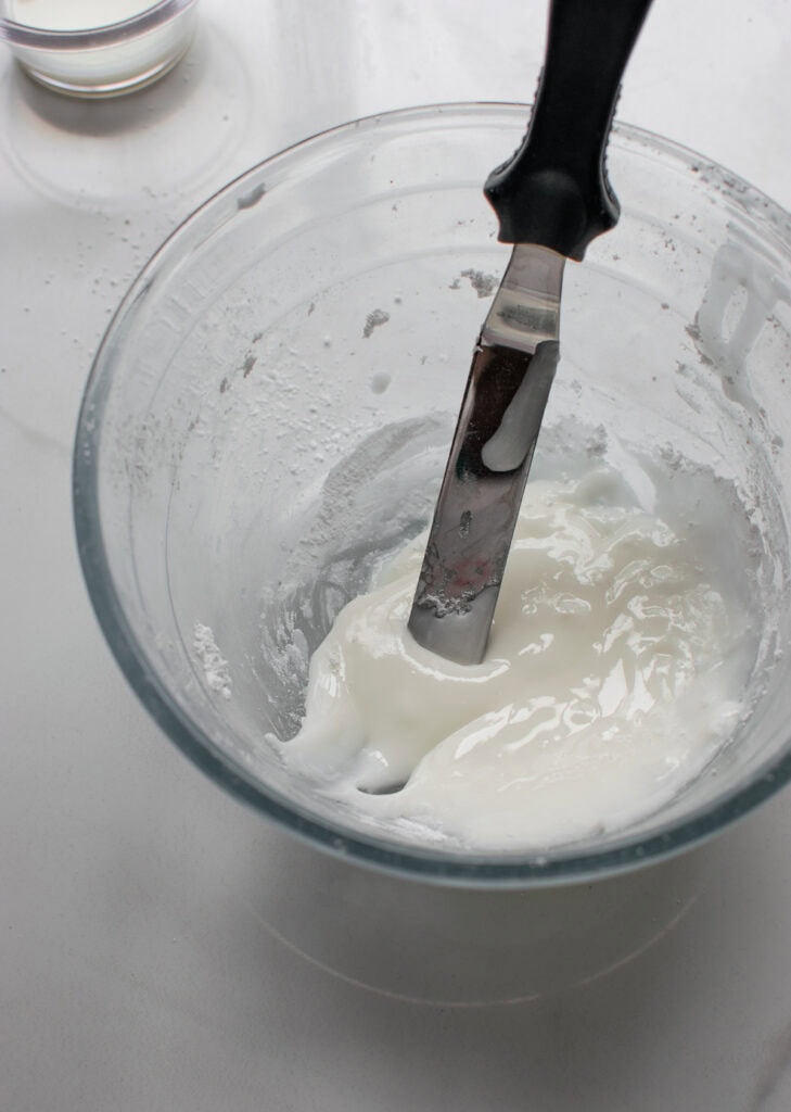 Simple frosting made with confectioners sugar and milk for frosting Bakewell tarts.