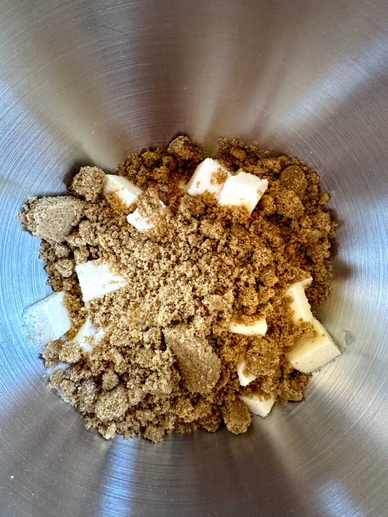 brown sugar and cubed butter in the bowl of a stand mixer.