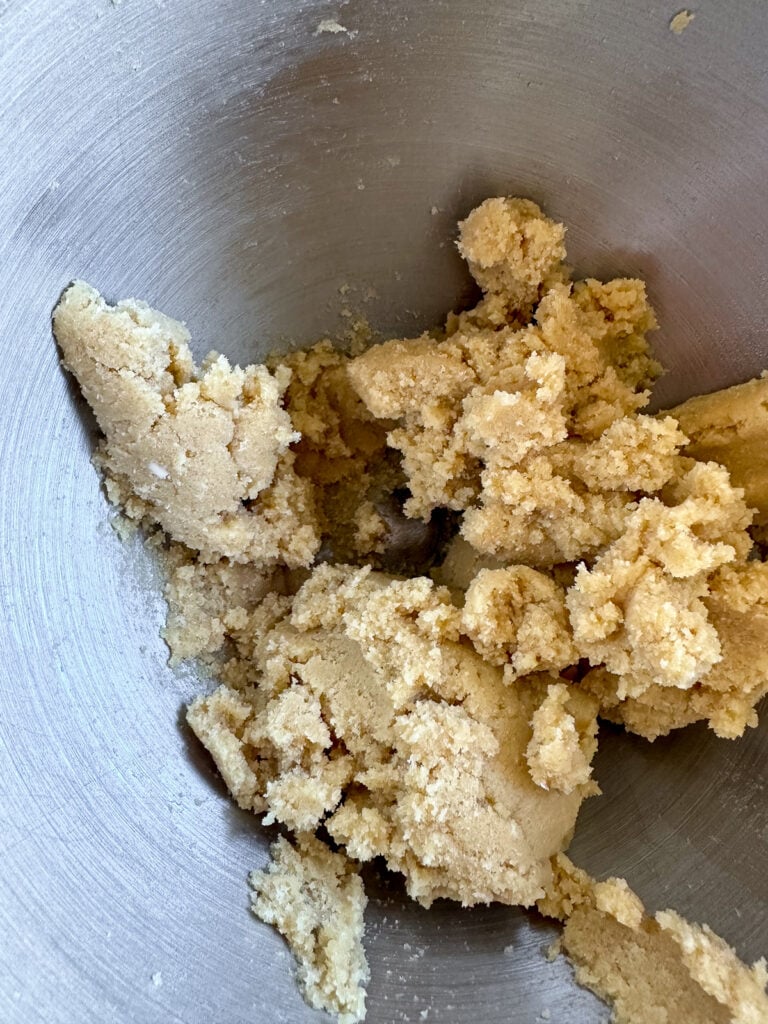 Brown sugar and butter that has been creamed together in the bowl of an electric mixer.