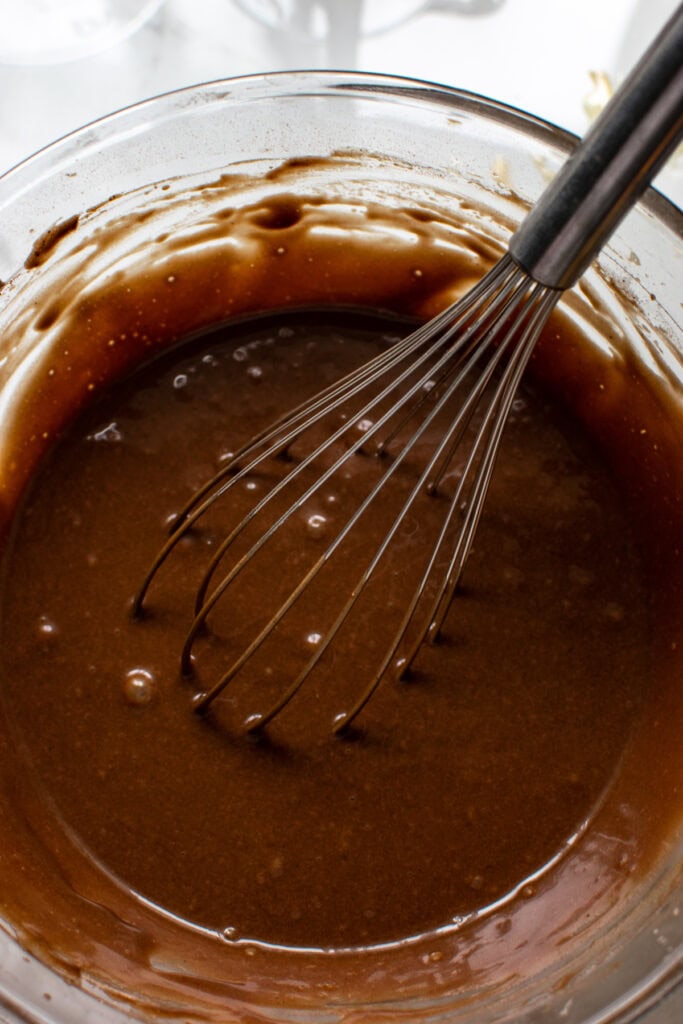 Chocolate coffee cupcake batter in a glass mixing bowl.