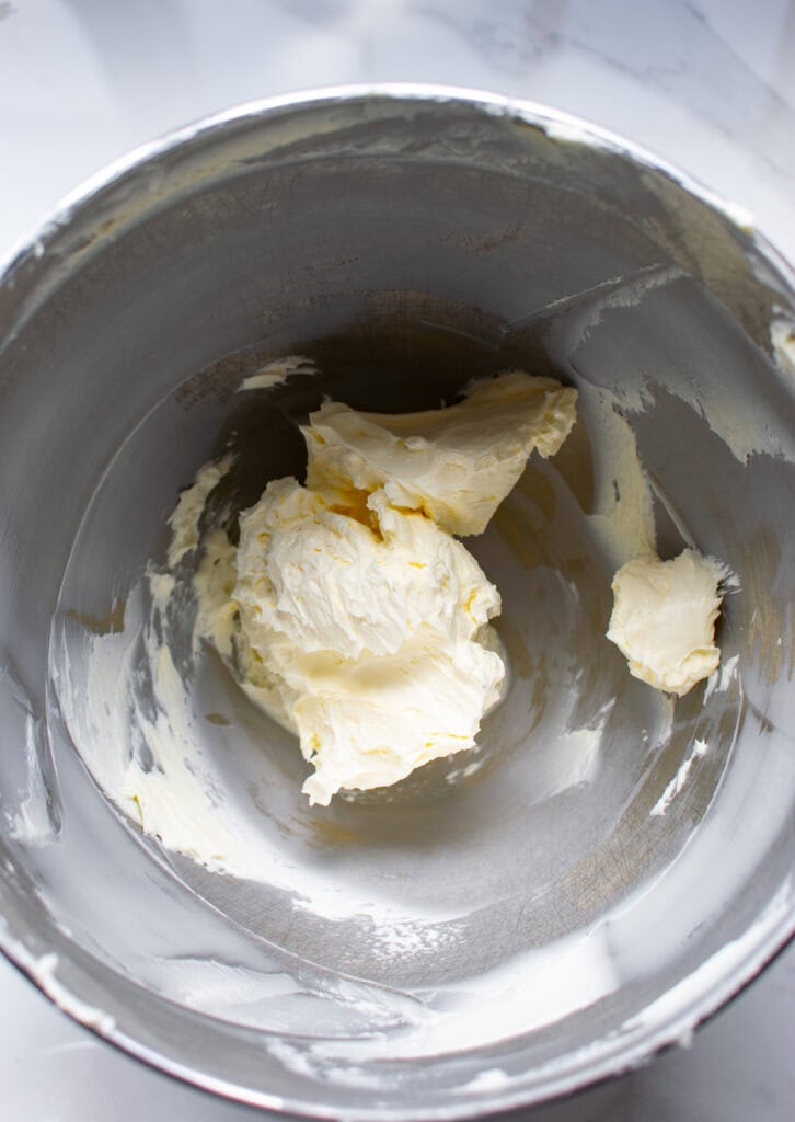 Butter whipped until light and fluff in a stand mixer bowl.