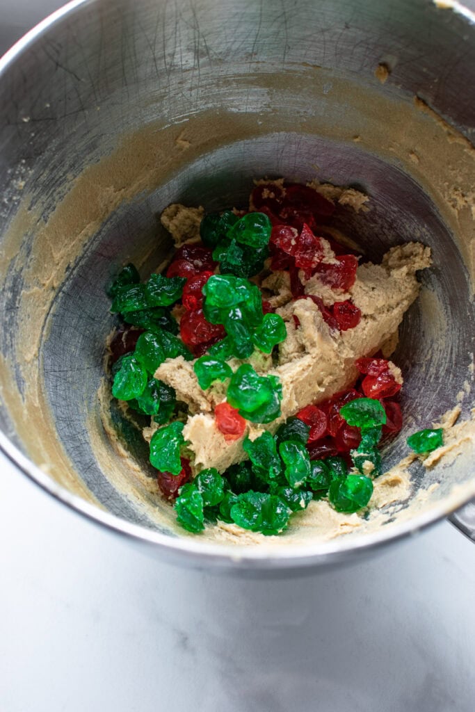 Red and green candied cherries added to cookie dough.