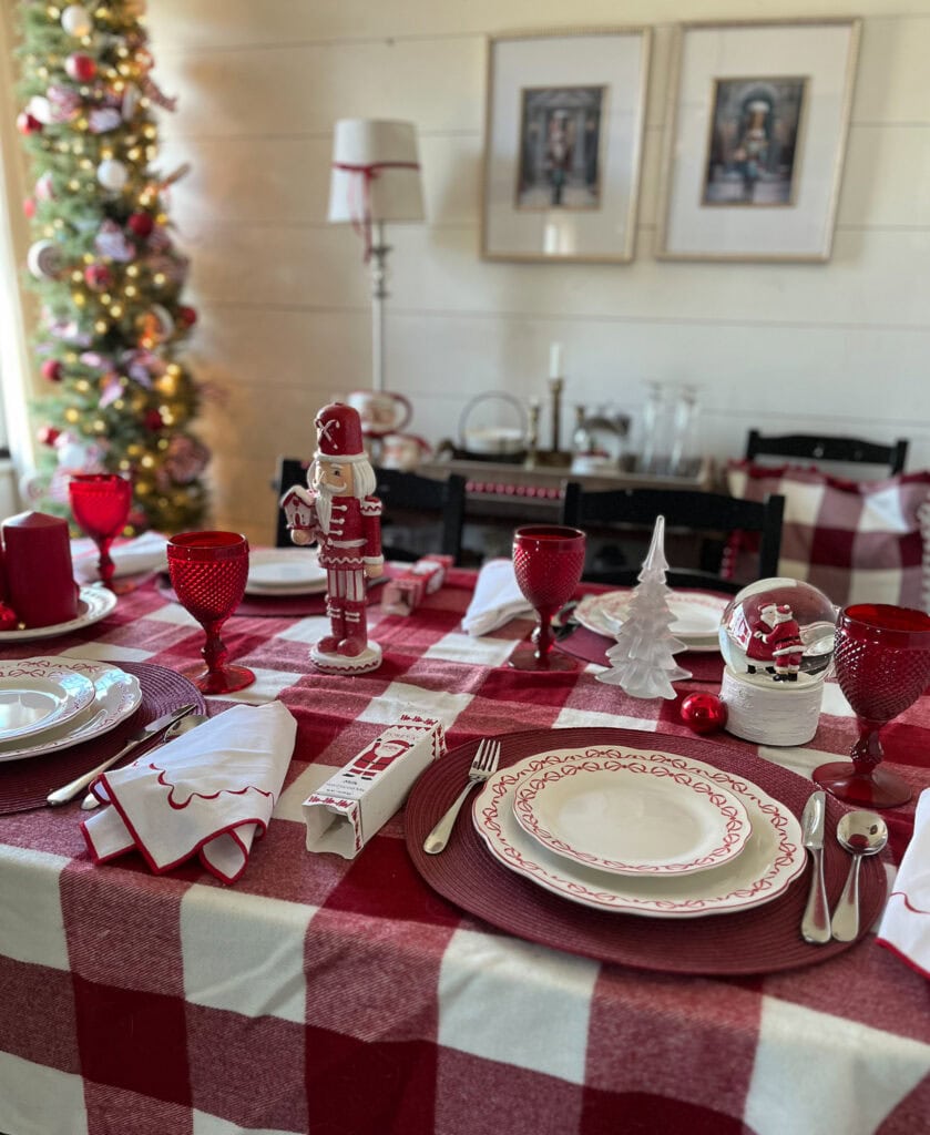 Red and White Christmas decor in the dining room, with a table set in all red and white.