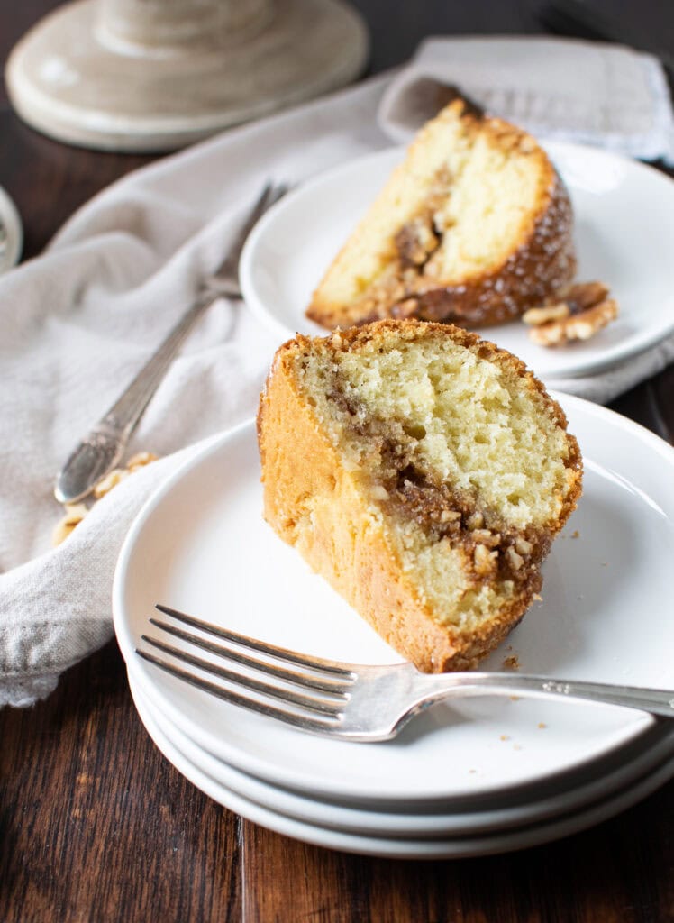 A slice of coffee cake on a white plate.