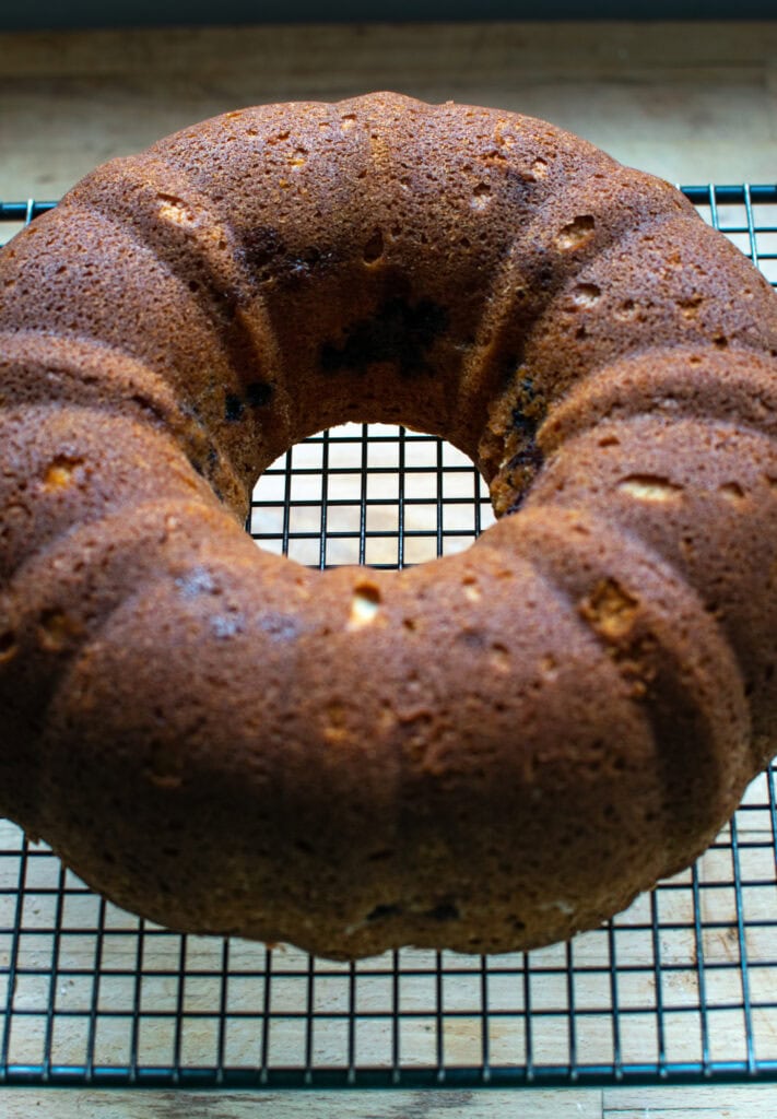 Blueberry Sour Cream Coffee Cake fresh out of the oven on a cooling rack.