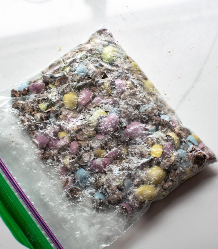 A Ziplock bag filled with crushed chocolate mini eggs.