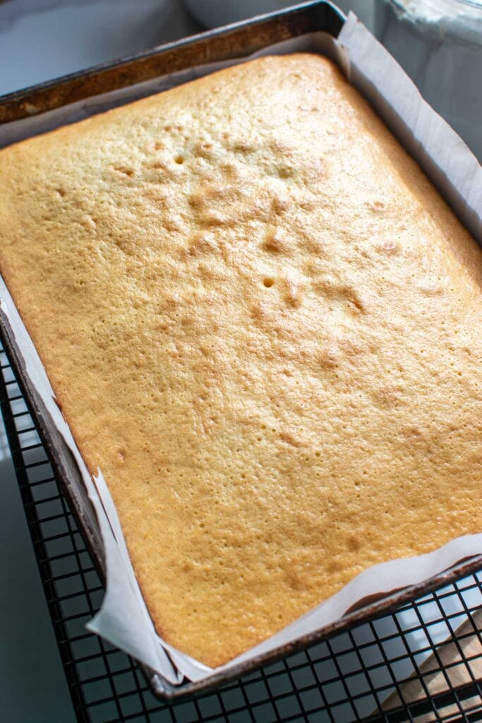 Freshly baked orange sheet cake still in the pan.