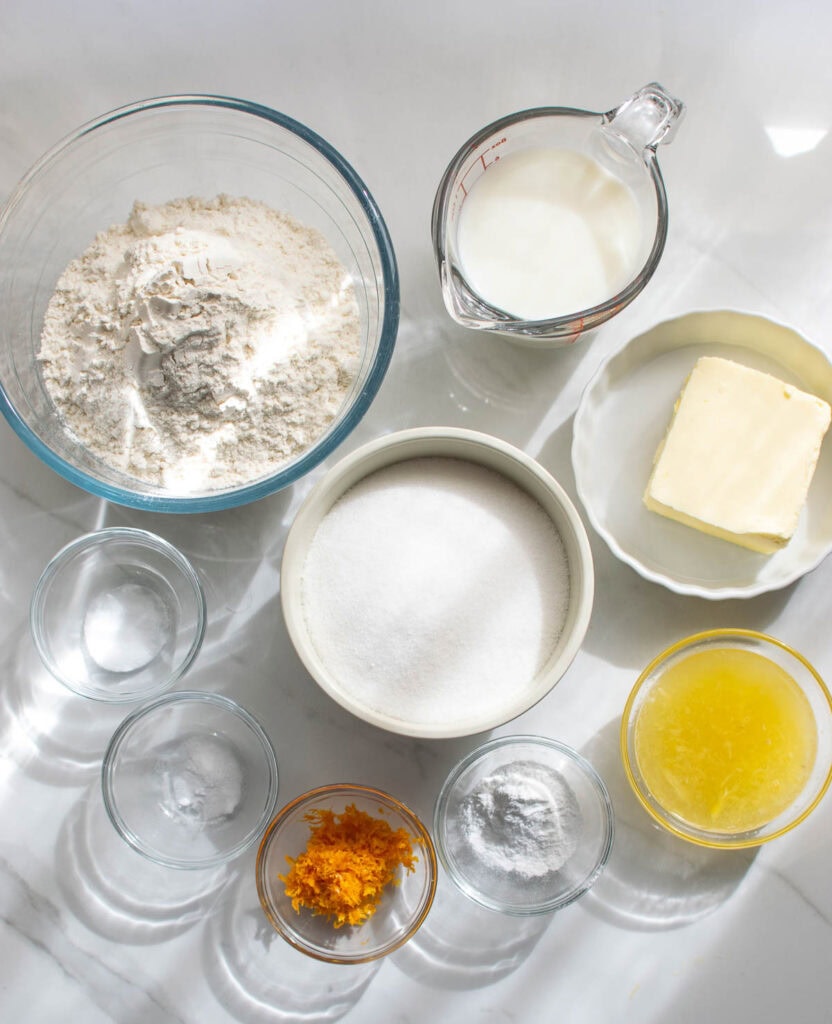 Ingredients to make an orange sheet cake.